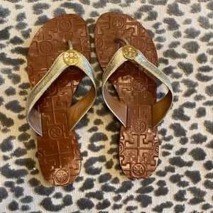 Tory Burch gold flip flops size 7